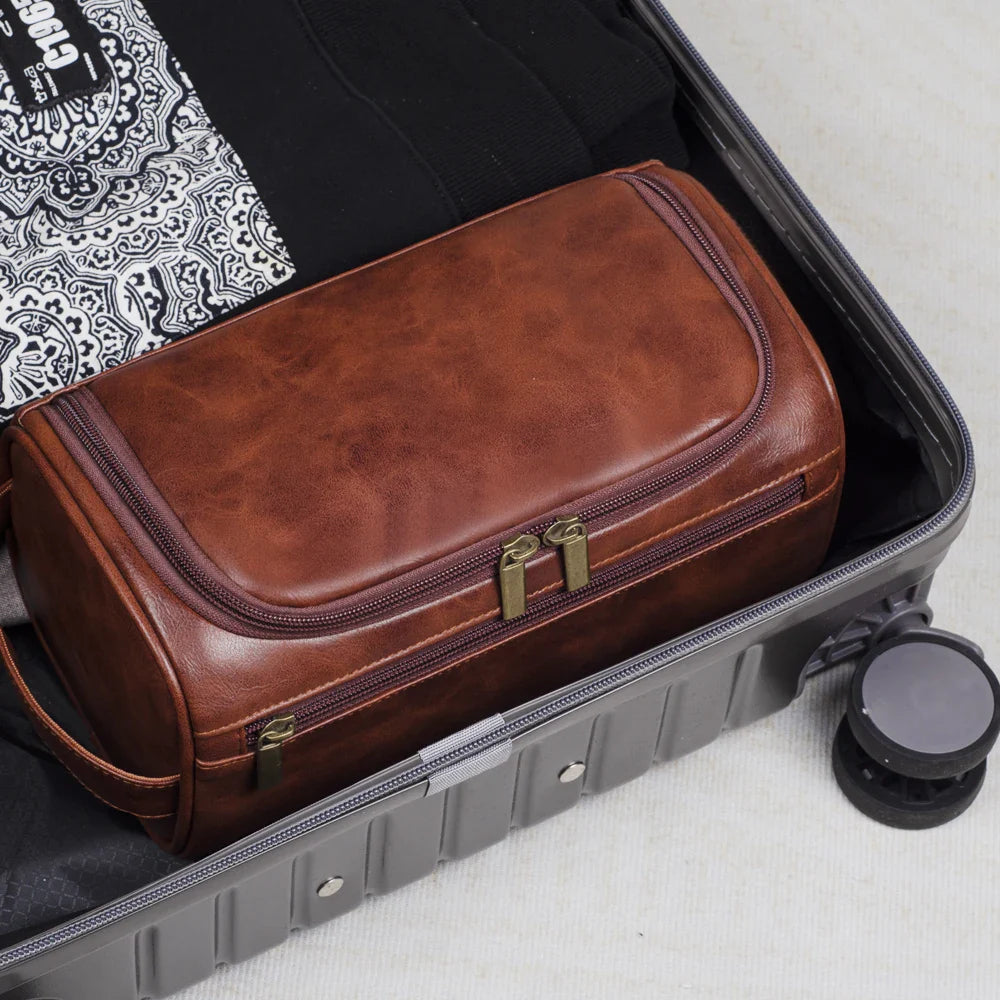 Stylish and compact toiletry bag with a durable design, featuring multiple zippers and a convenient handle for easy carrying, ideal for organizing essentials during travel.