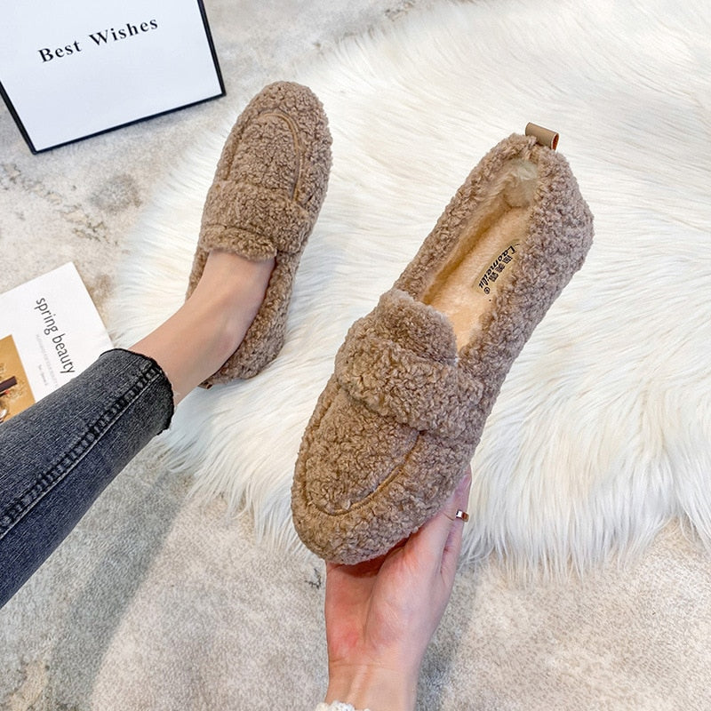 Plush slip-on women's shoes with a cozy and soft design, offering ultimate comfort and style for casual outings or indoor wear.
