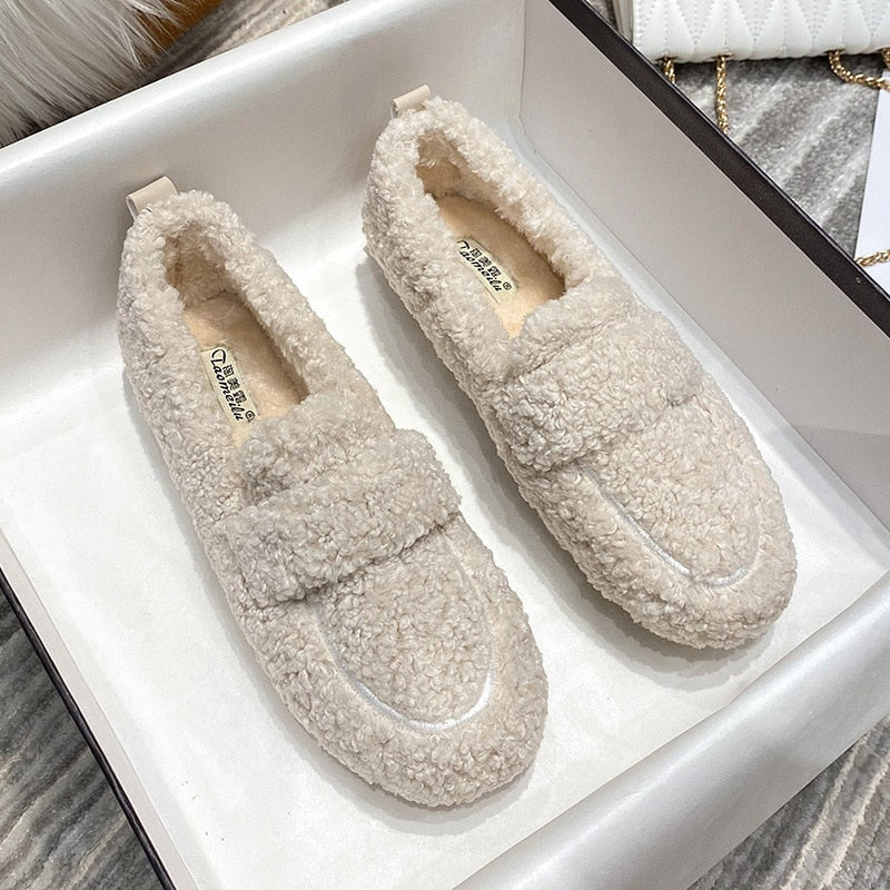 Plush slip-on women's shoes with a cozy and soft design, offering ultimate comfort and style for casual outings or indoor wear.