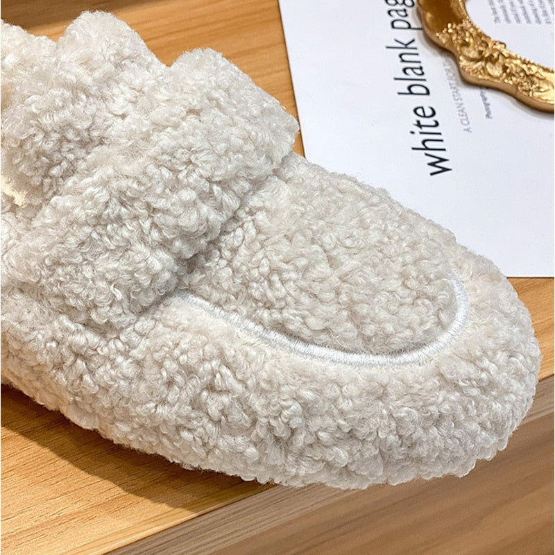 Plush slip-on women's shoes with a cozy and soft design, offering ultimate comfort and style for casual outings or indoor wear.