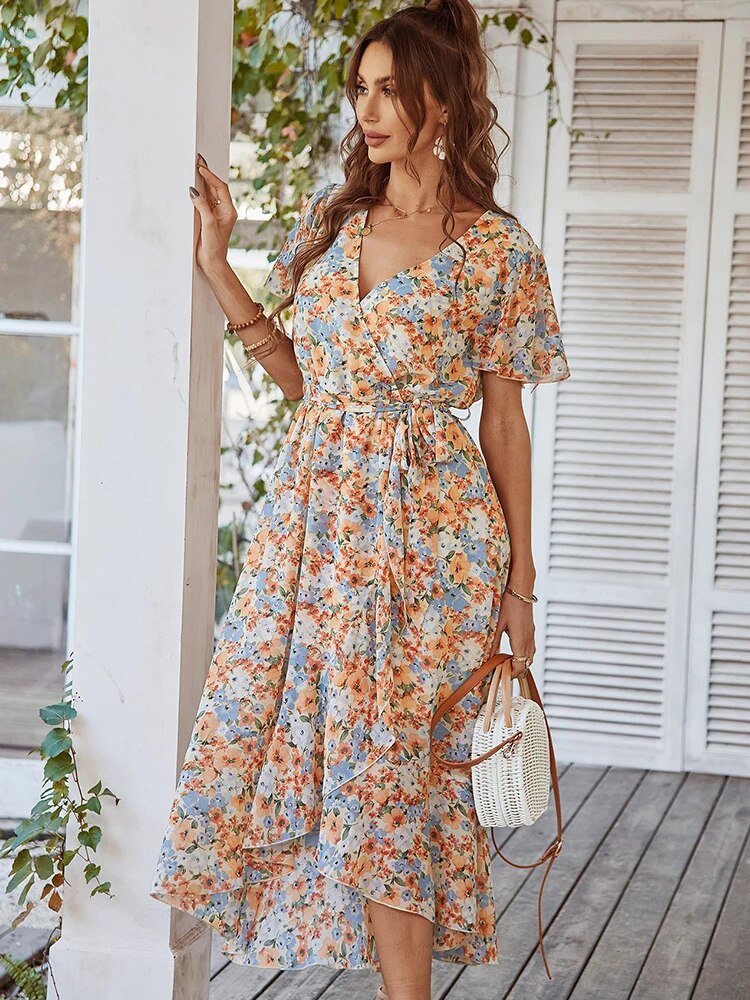 Embrace effortless elegance with the Ella Women's Floral Wrap Dress! Featuring a flattering V-neck and a flowing, floral design, this dress is perfect for casual outings or special events. Stay comfortable and chic with its lightweight fabric and timeless wrap silhouette.
