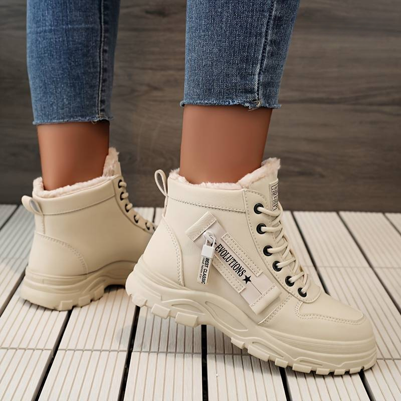 Stylish women's durable boots designed for comfort and warmth, featuring a cozy interior lining and sturdy soles, perfect for winter wear.