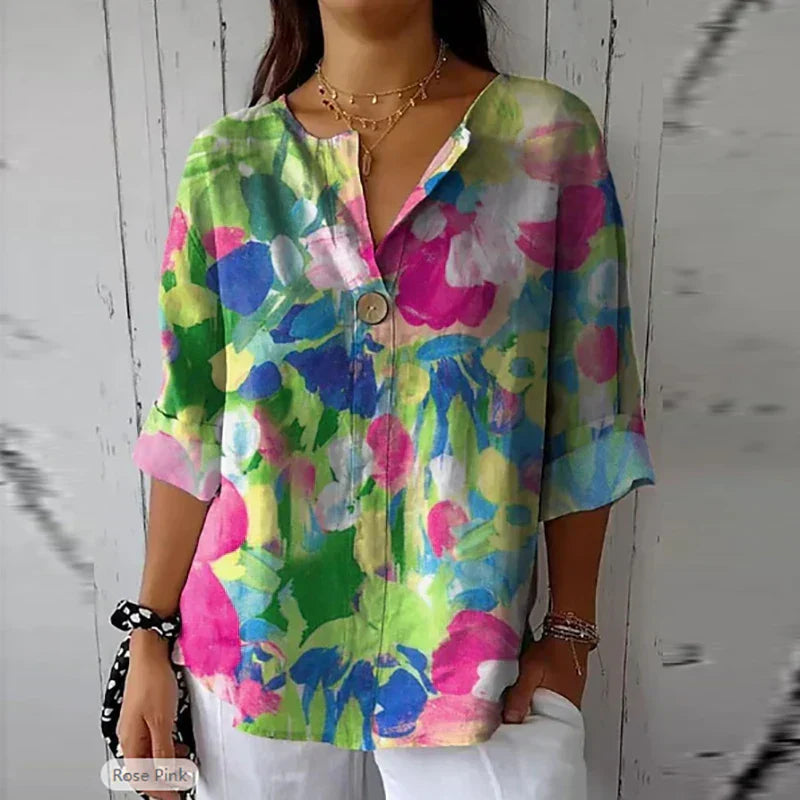 Women's floral blouse with an elegant design, featuring a button-down front and relaxed fit. Perfect for casual outings, workdays, or special occasions, offering a stylish and sophisticated look.