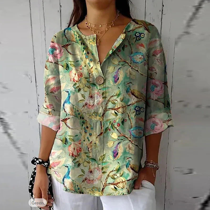 Women's floral blouse with an elegant design, featuring a button-down front and relaxed fit. Perfect for casual outings, workdays, or special occasions, offering a stylish and sophisticated look.