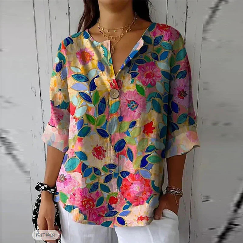 Women's floral blouse with an elegant design, featuring a button-down front and relaxed fit. Perfect for casual outings, workdays, or special occasions, offering a stylish and sophisticated look.