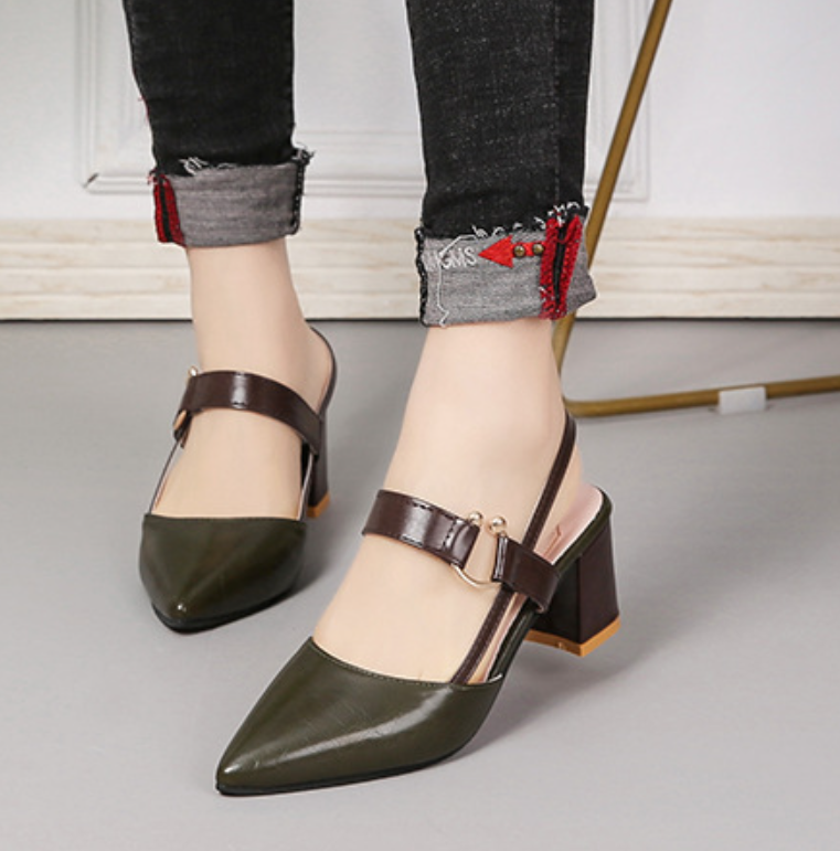 A pair of Sophia Women's Elegant Block Heel Shoes with a stylish double-strap design and pointed toe, worn by a person. These heels feature a comfortable block heel, perfect for adding elegance to both casual and formal outfits.