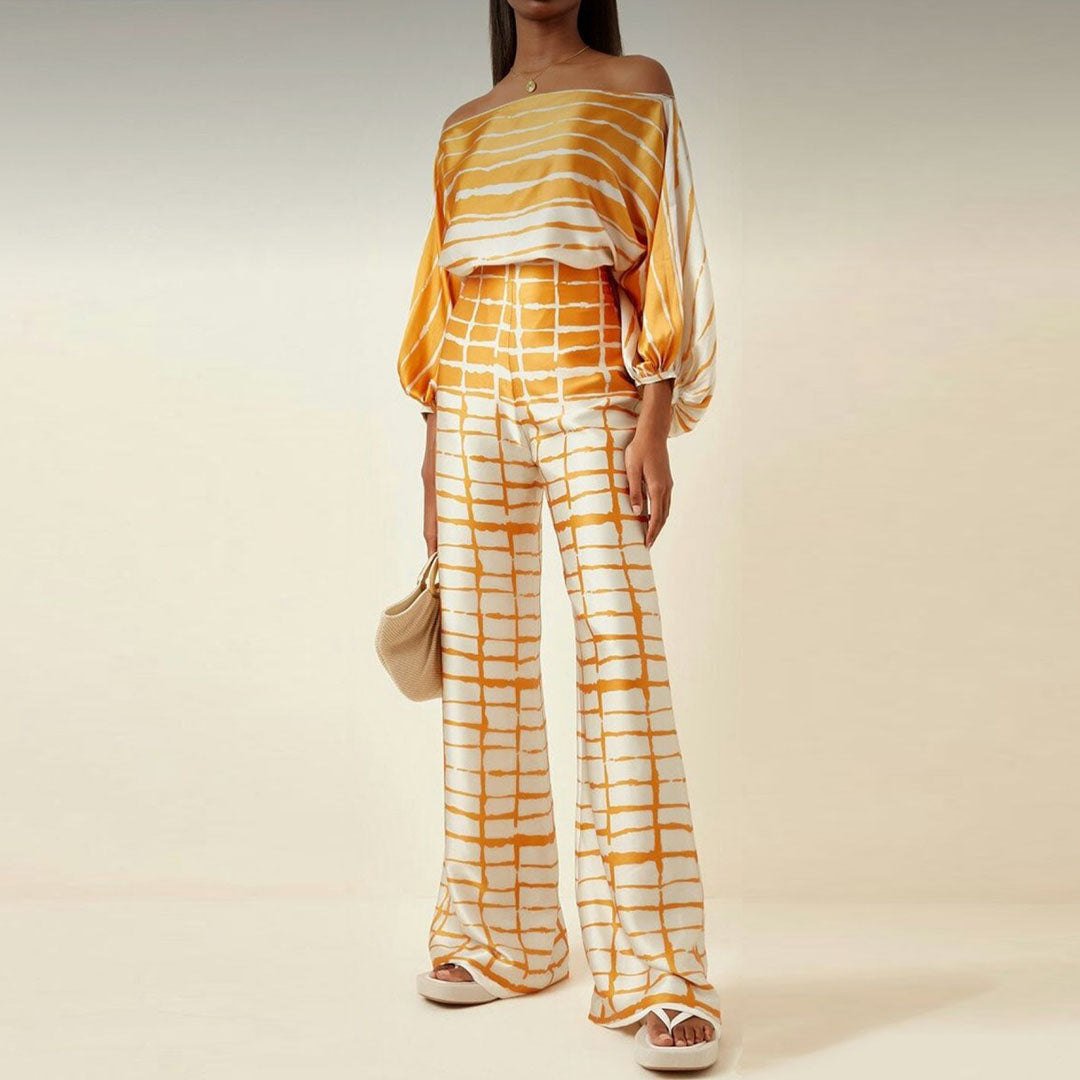 Women's summer jumpsuit with a flowing, one-shoulder design featuring vibrant patterns. Perfect for casual outings, beach days, or evening events, combining elegance and comfort for a chic summer look.