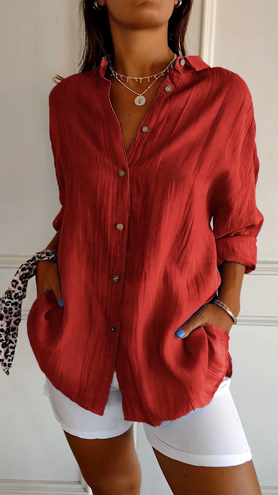 Stylish women's lightweight shirt with a relaxed fit, featuring button details and a casual, versatile design ideal for everyday wear.