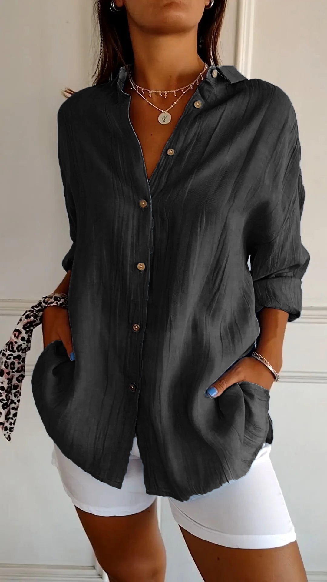 Stylish women's lightweight shirt with a relaxed fit, featuring button details and a casual, versatile design ideal for everyday wear.