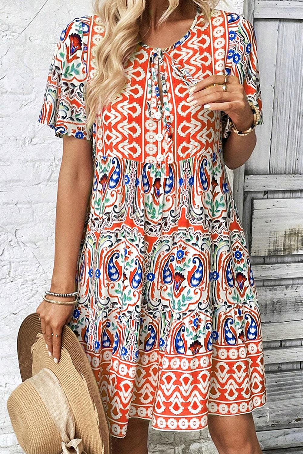 Model wearing the Sienna Women's Boho Print Dress, showcasing a relaxed fit and intricate bohemian-inspired patterns. The dress features a deep V-neckline, short sleeves, and a flowy, casual design ideal for warm-weather outings.