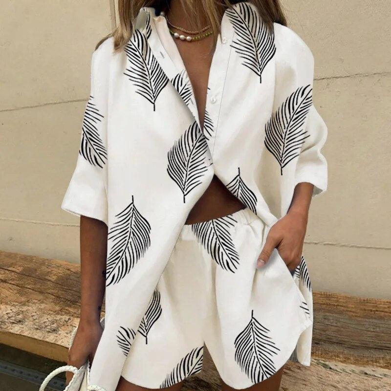 Stylish women's outfit set featuring a button-up top with an elegant leaf pattern and matching shorts, designed for a relaxed and fashionable fit, perfect for casual and summer wear.