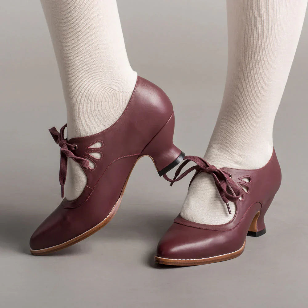 Image showing women's vintage heels with a stylish bow tie design and elegant cut-out details, perfect for adding a chic touch to formal or semi-formal outfits.