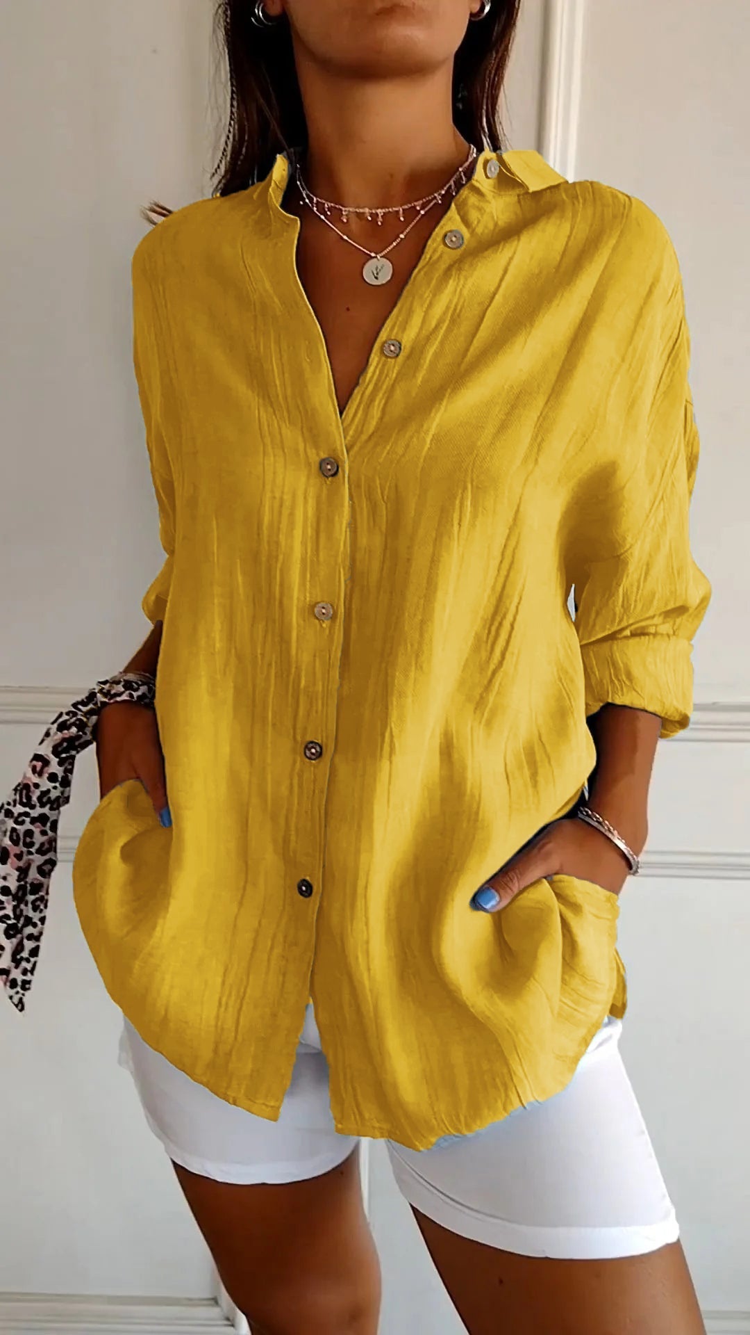 Stylish women's lightweight shirt with a relaxed fit, featuring button details and a casual, versatile design ideal for everyday wear.