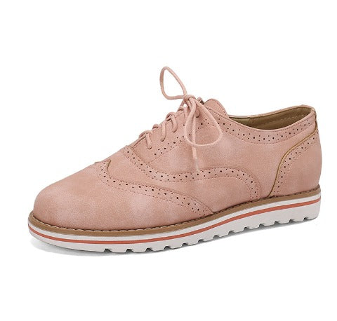 Image showing women's classic sneakers with a stylish brogue design, featuring lace-up closure and a comfortable sole, perfect for casual wear.