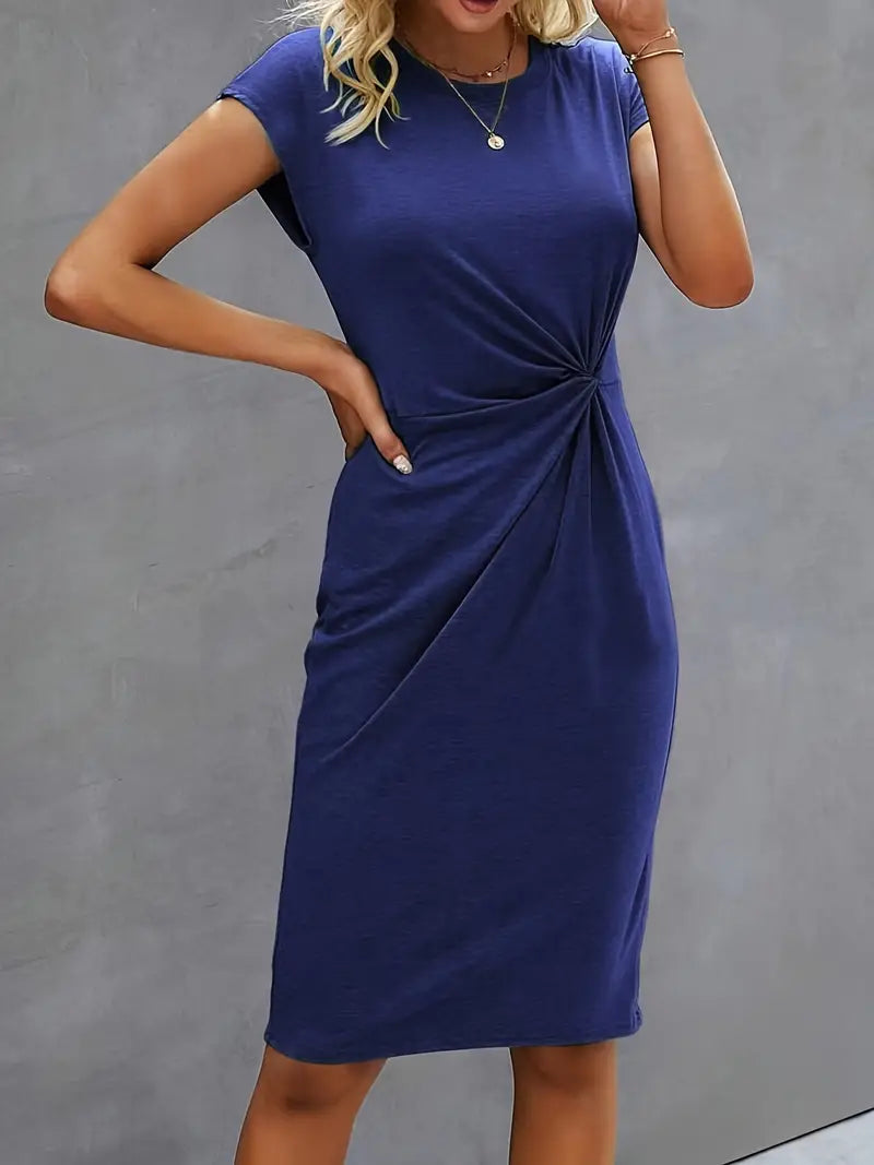 A woman wearing an elegant dress with a flattering ruched design, perfect for both casual outings and formal events. The dress highlights a sophisticated and stylish silhouette, paired with a clutch for a polished look.