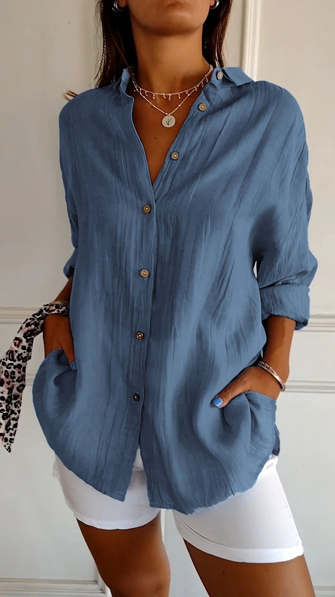 Stylish women's lightweight shirt with a relaxed fit, featuring button details and a casual, versatile design ideal for everyday wear.