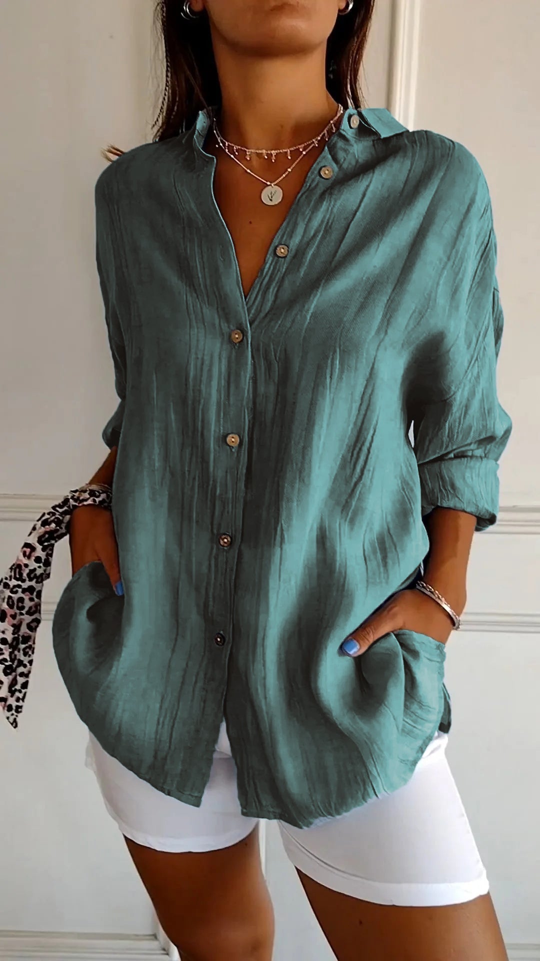 Stylish women's lightweight shirt with a relaxed fit, featuring button details and a casual, versatile design ideal for everyday wear.
