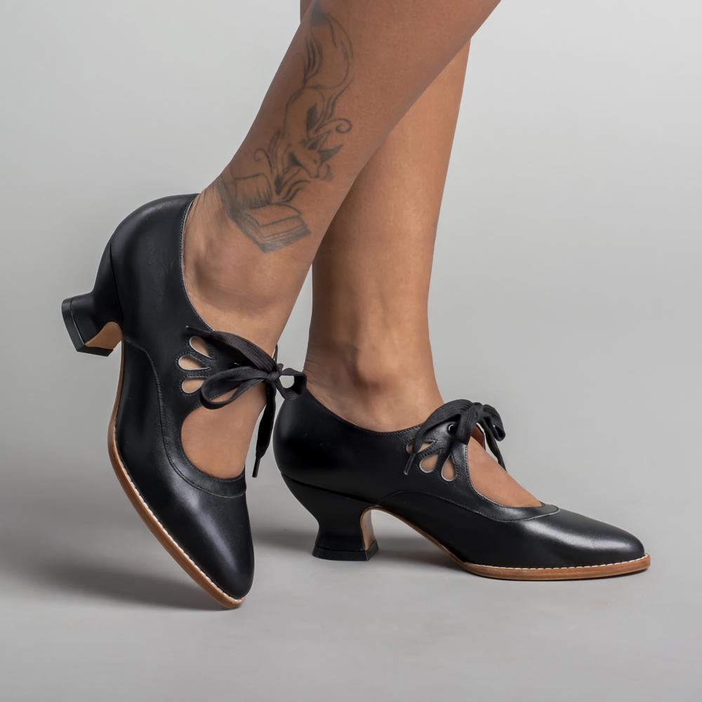 Image showing women's vintage heels with a stylish bow tie design and elegant cut-out details, perfect for adding a chic touch to formal or semi-formal outfits.