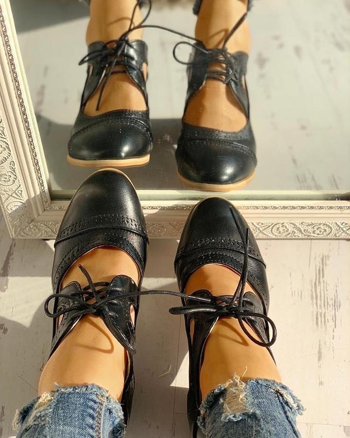 Elegant women's heeled shoes with lace-up detailing and a timeless design, paired with denim pants. Perfect for casual or formal occasions.