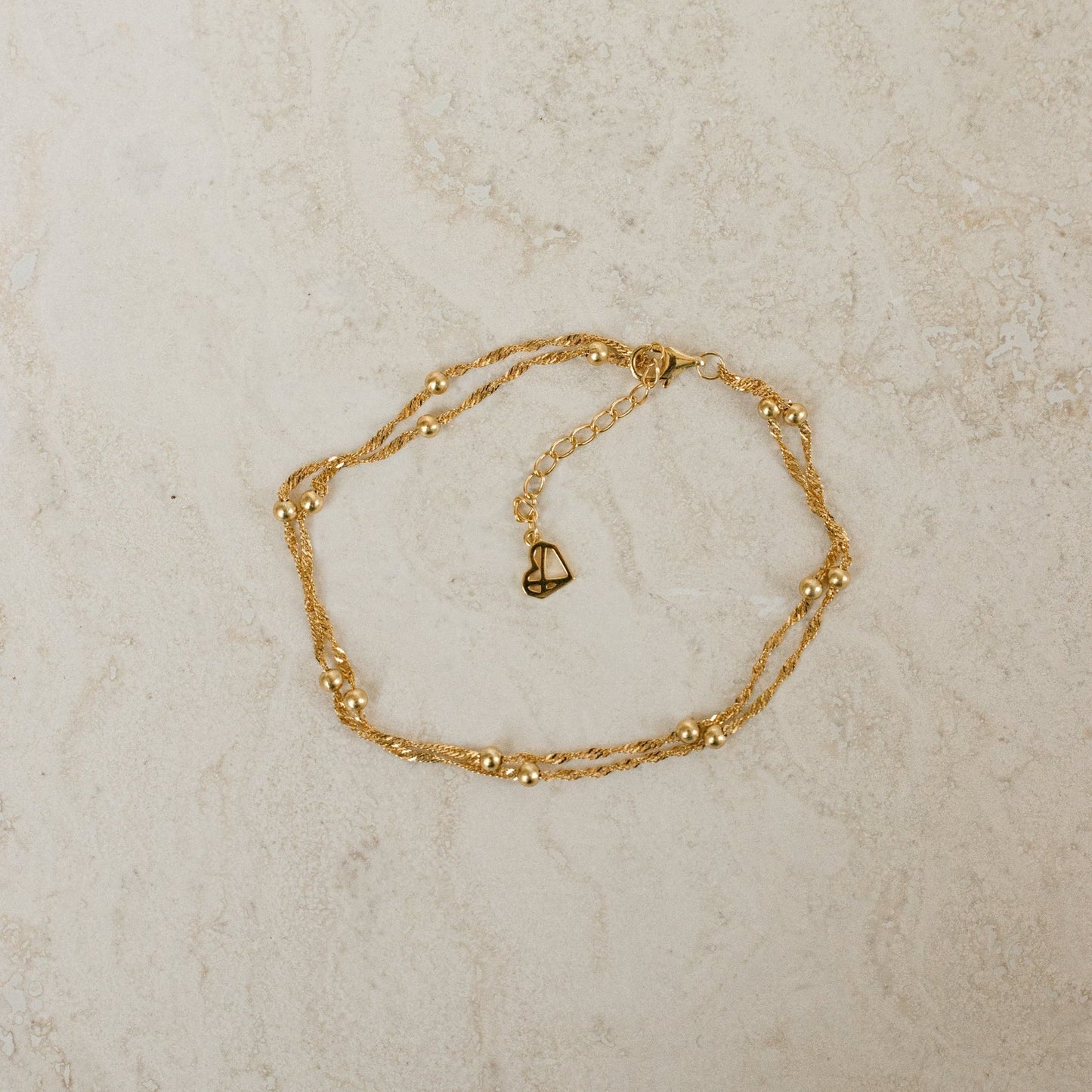 Close-up of a model wearing the Sofia Women's Delicate Bracelet, featuring a minimalist and elegant design, perfect for adding a subtle touch of sophistication to any outfit.