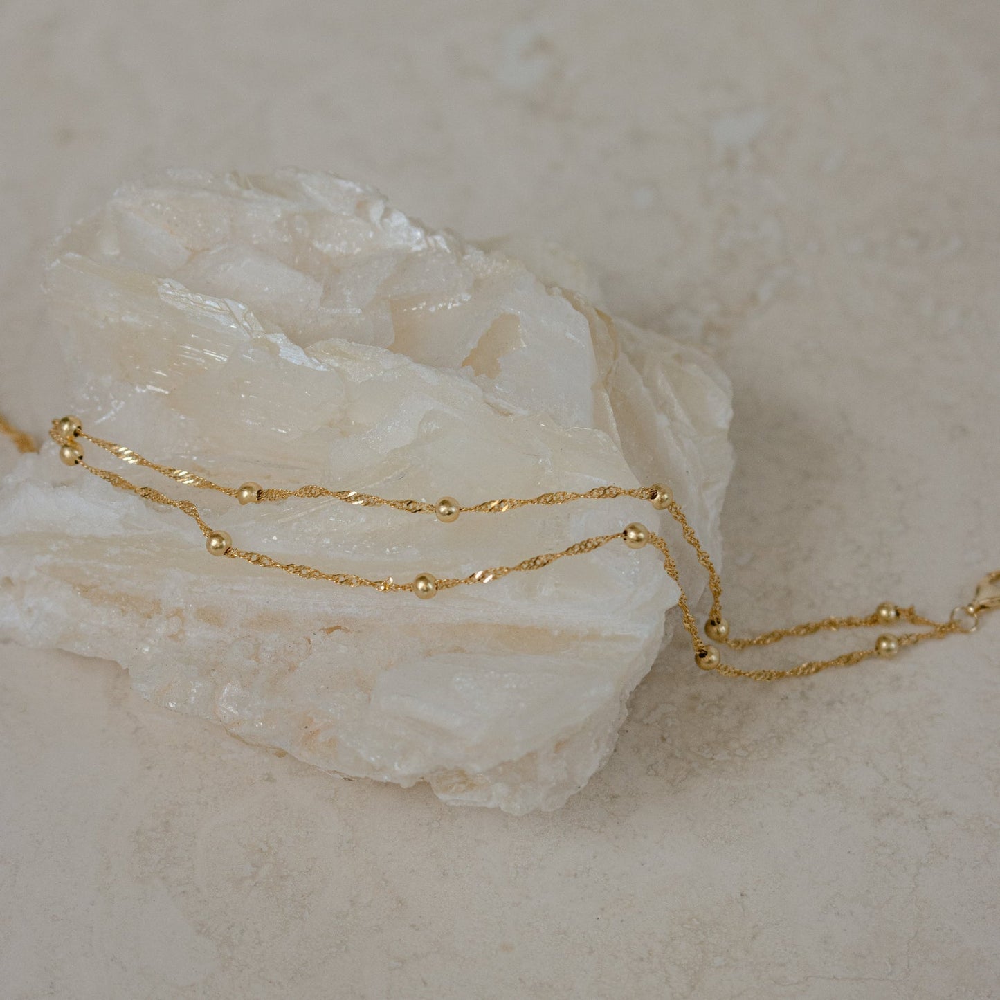 Close-up of a model wearing the Sofia Women's Delicate Bracelet, featuring a minimalist and elegant design, perfect for adding a subtle touch of sophistication to any outfit.
