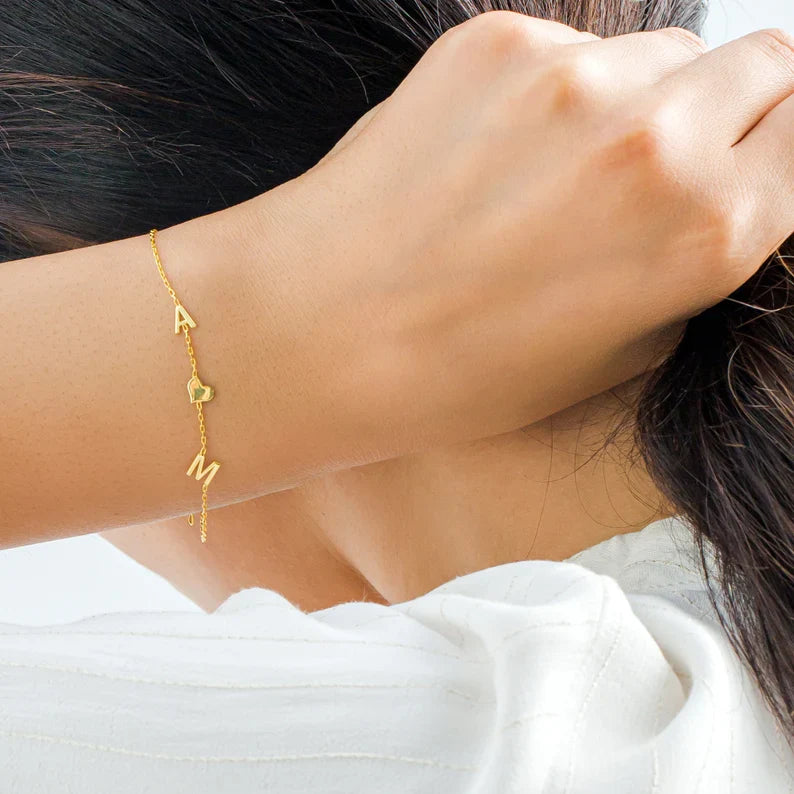 Close-up of a model wearing the Elena Women's Personalized Bracelet featuring a custom name design, paired with a matching personalized necklace for a chic and meaningful look.