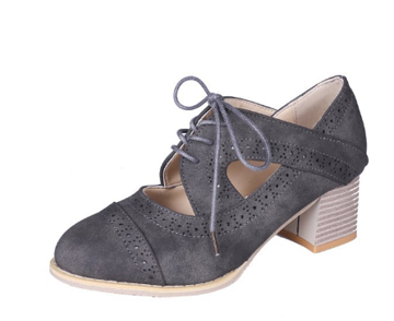 Elegant women's heeled shoes with lace-up detailing and a timeless design, paired with denim pants. Perfect for casual or formal occasions.