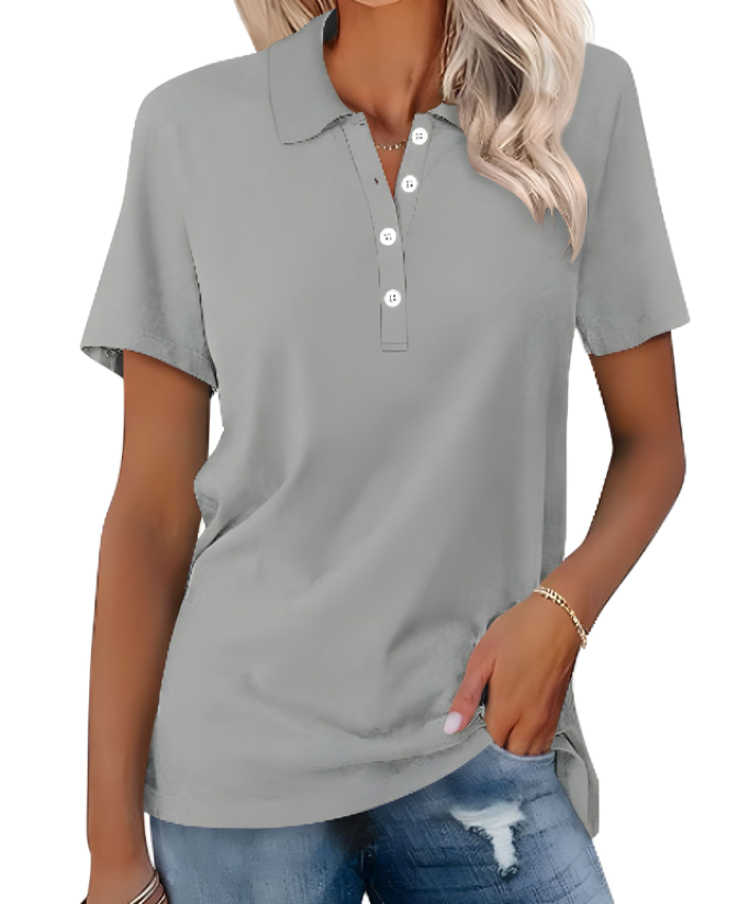 Image showing a stylish women's polo shirt with a classic design, short sleeves, and buttoned collar, paired with casual denim jeans for a chic everyday look.