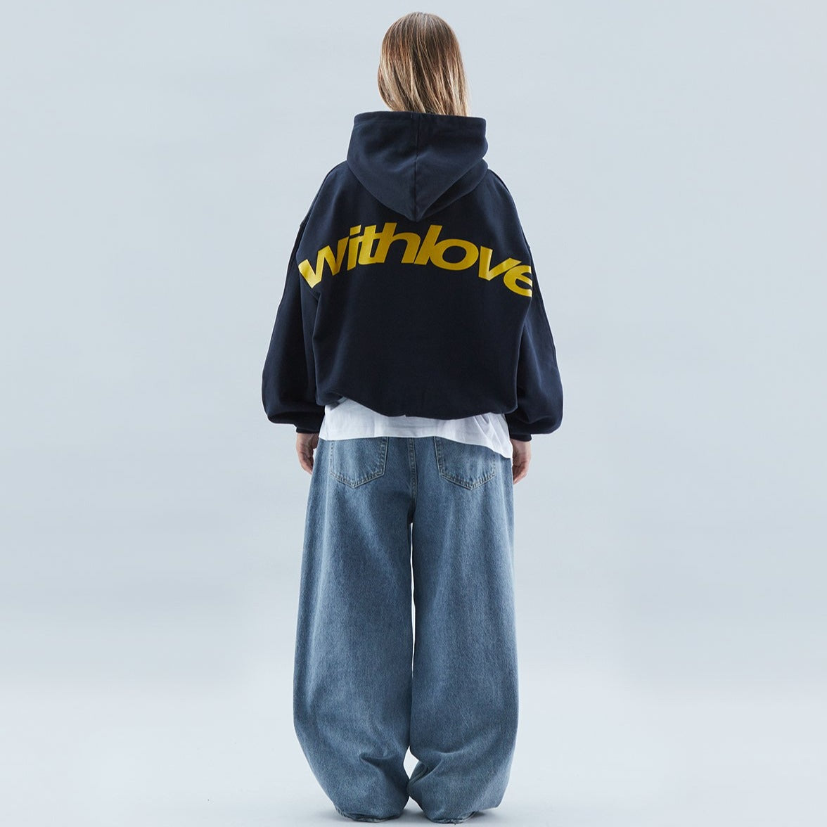 A person wearing the Harper Women's Oversized Hoodie paired with relaxed-fit jeans, showcasing the casual and comfortable style of the hoodie.