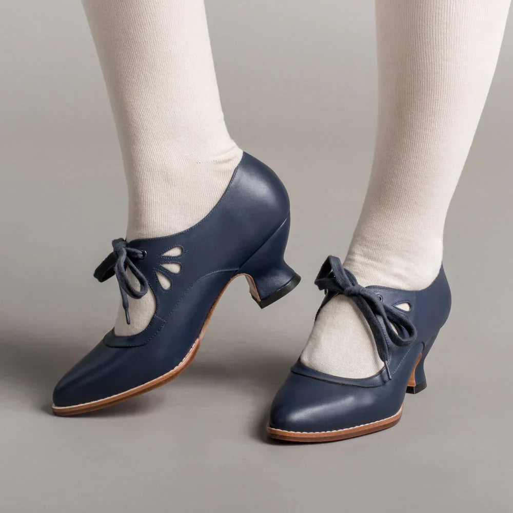 Image showing women's vintage heels with a stylish bow tie design and elegant cut-out details, perfect for adding a chic touch to formal or semi-formal outfits.