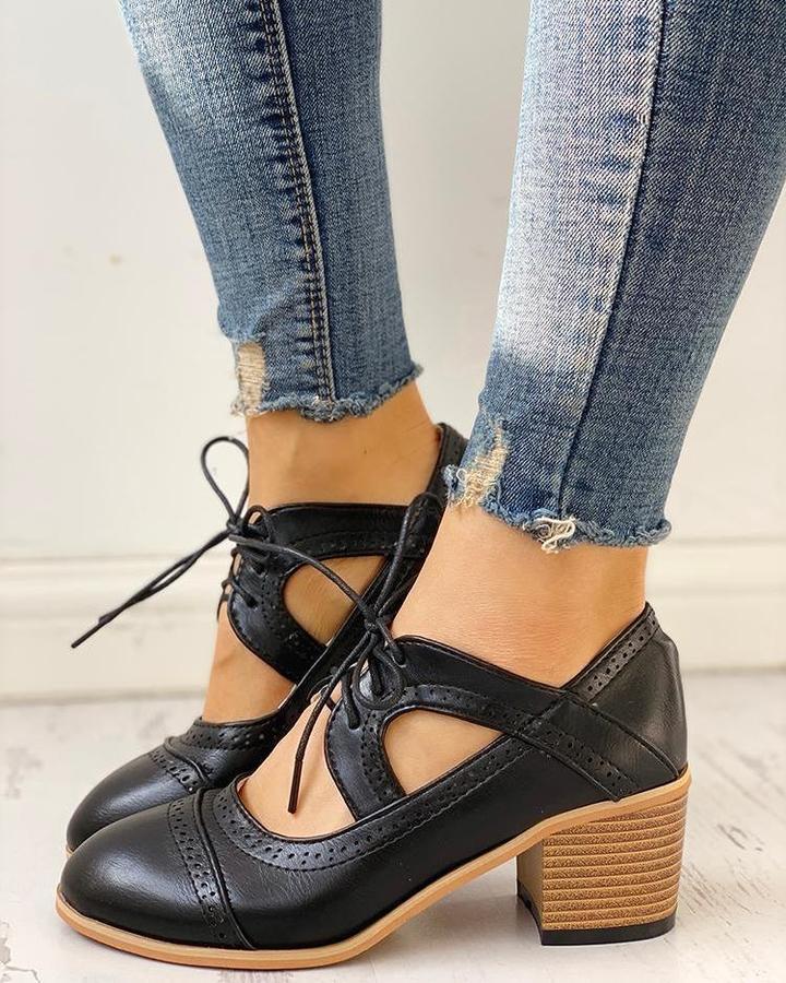 Elegant women's heeled shoes with lace-up detailing and a timeless design, paired with denim pants. Perfect for casual or formal occasions.