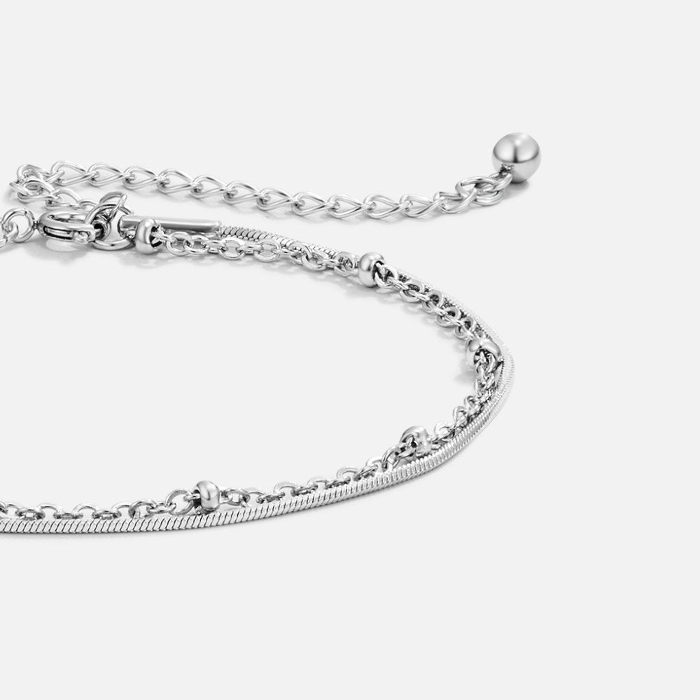 Close-up of the Lily Women's Charm Bracelet showcasing delicate charms and an elegant design, perfect for adding a personalized touch to any outfit. A versatile accessory for various occasions.