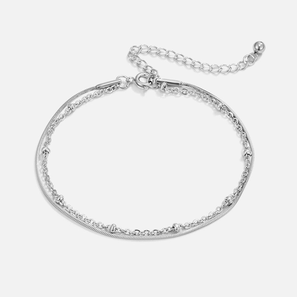 Close-up of the Lily Women's Charm Bracelet showcasing delicate charms and an elegant design, perfect for adding a personalized touch to any outfit. A versatile accessory for various occasions.