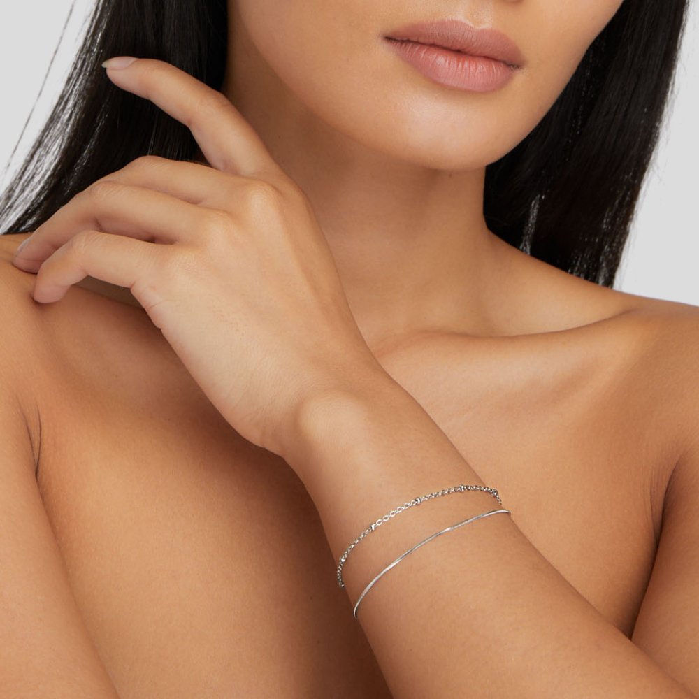 Close-up of the Lily Women's Charm Bracelet showcasing delicate charms and an elegant design, perfect for adding a personalized touch to any outfit. A versatile accessory for various occasions.