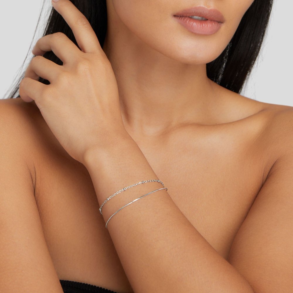 Close-up of the Lily Women's Charm Bracelet showcasing delicate charms and an elegant design, perfect for adding a personalized touch to any outfit. A versatile accessory for various occasions.