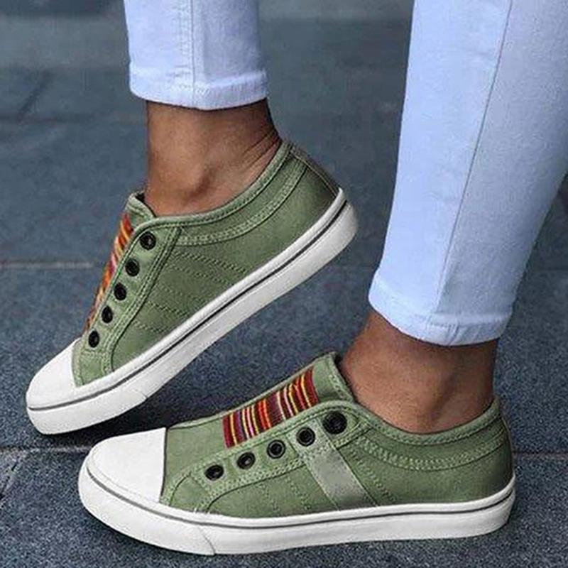 Image showing women's casual sneakers with stylish striped detailing and a classic design, perfect for everyday wear and casual outings.