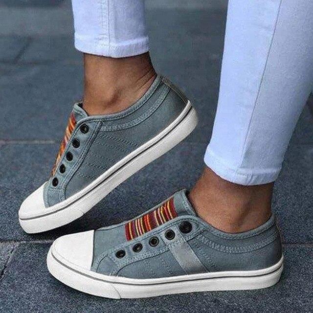 Image showing women's casual sneakers with stylish striped detailing and a classic design, perfect for everyday wear and casual outings.