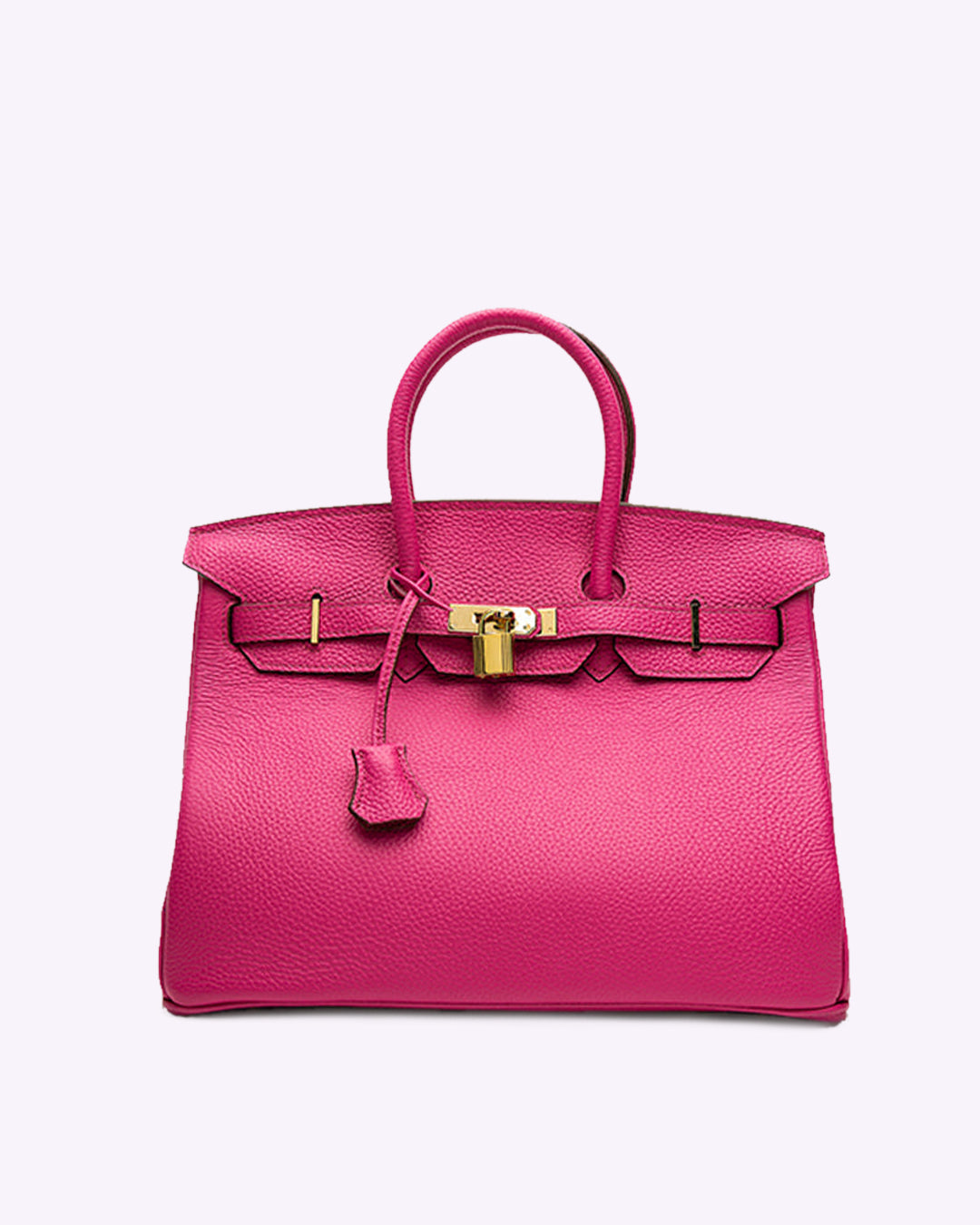 Image showing a woman holding an elegant handbag with a sleek design, featuring gold hardware and a structured shape, paired with casual attire for a stylish, sophisticated look.