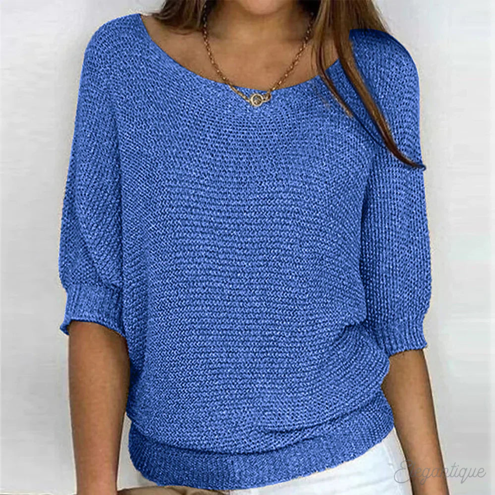 Image of a woman wearing an elegant relaxed fit sweater, featuring a chic design perfect for casual and stylish occasions.