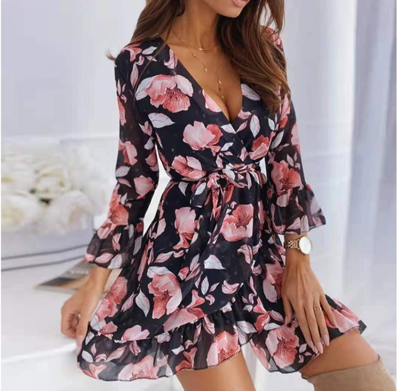 Woman wearing the Sofia Women's Floral Wrap Dress with flowy ruffles, featuring a flattering wrap design and delicate floral pattern, styled for a chic and romantic look.