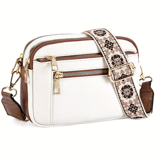  A woman sitting on a balcony railing wearing a stylish crossbody bag with an elegant design, featuring multiple compartments and an adjustable strap, ideal for everyday use.