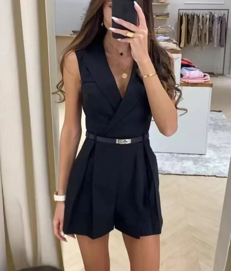 Model wearing a stylish sleeveless belted romper with a flattering V-neckline and tailored fit, perfect for casual outings or dressed-up occasions.