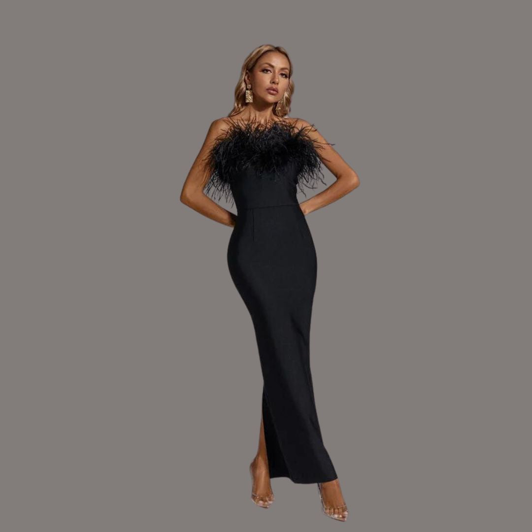 A woman showcasing the Camille Women's Feathered Evening Dress, featuring elegant feather detailing at the neckline and a sleek, form-fitting gown design, perfect for formal occasions or special events.