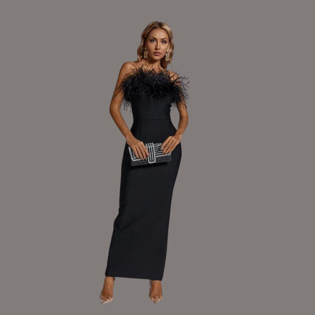 A woman showcasing the Camille Women's Feathered Evening Dress, featuring elegant feather detailing at the neckline and a sleek, form-fitting gown design, perfect for formal occasions or special events.