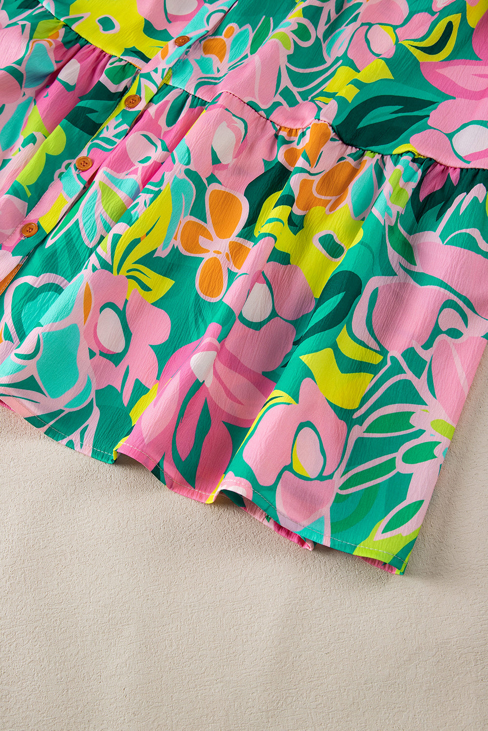 Back view of the Lily Women's Floral Tiered Dress, showcasing a vibrant floral pattern with tiered layers and short puff sleeves.