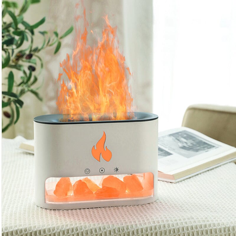 Image showing an aroma diffuser with a sleek design, featuring a button control and a compartment for essential oils, creating a relaxing atmosphere with a flame-like display effect.