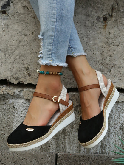 An image showcasing stylish women's wedge sandals with a comfortable design, featuring adjustable ankle straps and a supportive sole, perfect for casual or semi-formal outings.
