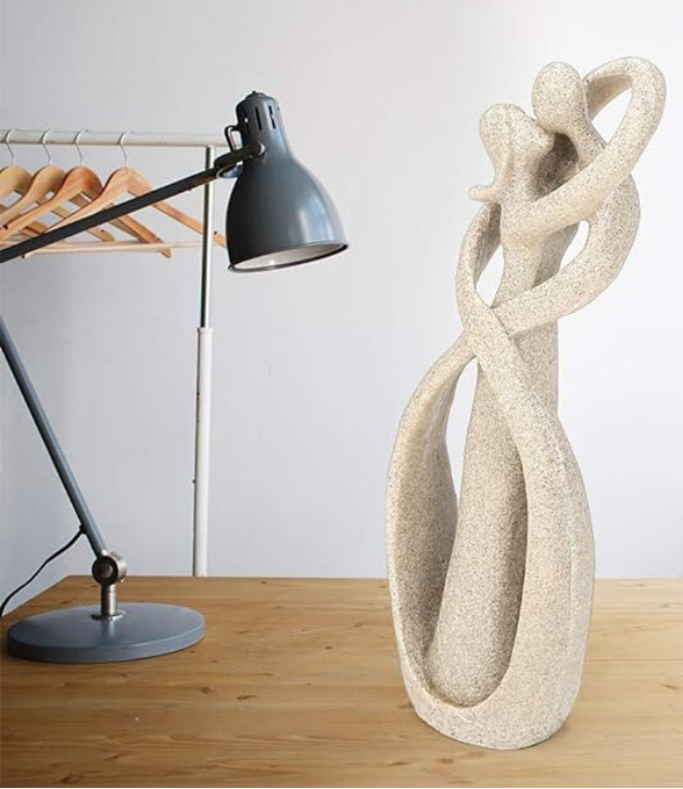 Elegant artistic sculptures showcasing intertwined figures, perfect for enhancing home décor with a touch of sophistication and timeless design.