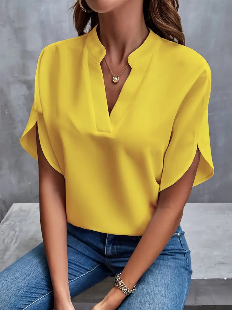 Image showing a woman wearing the Clara Women's Stylish Top, featuring a sleek and elegant design with a flattering neckline, paired with jeans for a chic and versatile look.