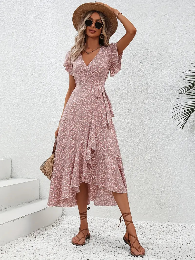 Model wearing the Lily | Flowy Wrap Midi Dress, featuring a flattering wrap design with flutter sleeves and a midi length. Perfect for casual outings and summer events, this dress offers a light, breezy, and feminine look.